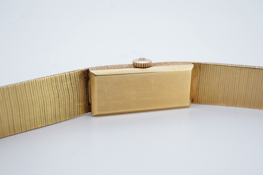 A lady's 1960's 18ct gold manual wind bracelet watch, overall length 16.5cm, gross weight 37.1 grams. Condition - fair to good